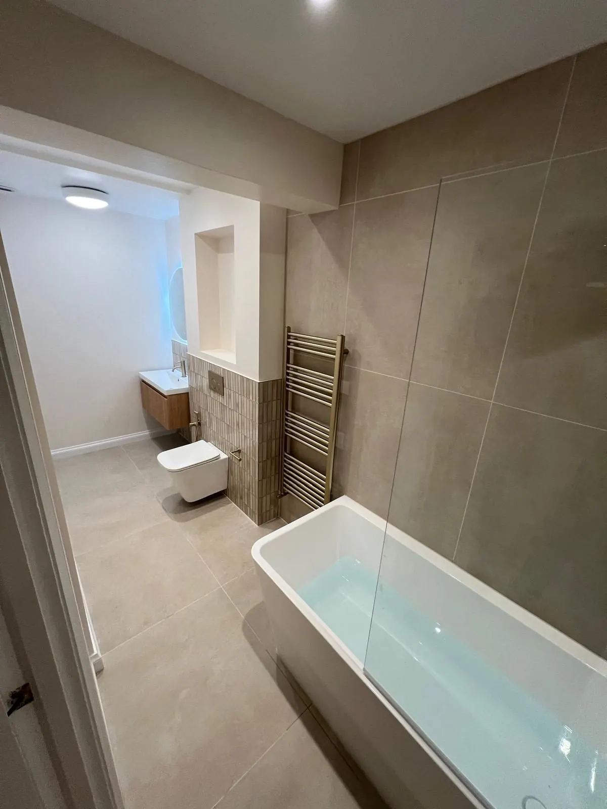 Bathroom WC and shower area by SFB Interior Refurbishment Ltd